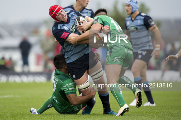 Seb Davies of Cardiff tackled by Cian Kelleher and Jarrad Butler of Connacht during the Guinness PRO14 Conference A match between Connacht R...