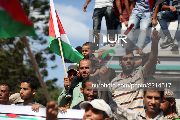 Palestinians of the Union of Agricultural Work Committees take part in a support of the Palestinian reconciliation, in Gaza city, on Septemb...