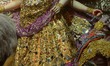 An Idol goddess of Durga with a saree made of 22 kgs of gold beautified with zari work emb...