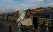 Rohingya refugee man with aid at the Balukhali refugee camp in Ukhiya, Cox’s Bazar, Bangla...