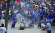 Nepalese devotees splash a water buffalo with water on Hanumante River as part of rituals...