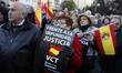 Protestors hold spanish flags and reivindicative banners during a protest against the non-...