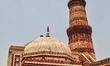Qutab Minar tower and the Tomb of Imam Zamin at the Qutub Minar complex in Delhi, India, o...