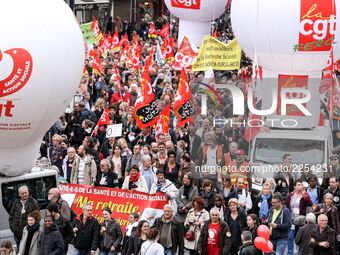 Thousands of public sector workers march through Paris on October 10, 2017, as part of a nationwide strike organized by the country's nine m...