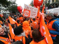 Thousands of public sector workers march through Paris on October 10, 2017, as part of a nationwide strike organized by the country's nine m...