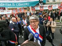 La France Insoumise (LFI) leftist party's member of Parliament Eric Coquerel (C) speaks with press during a demonstration in Paris, France,...