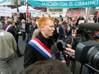La France Insoumise (LFI) leftist party's member of Parliament Adrien Quatennens (C) speaks with press during a demonstration in Paris, Fran...