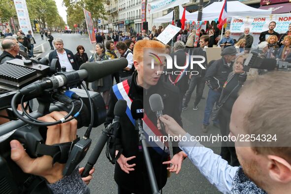 La France Insoumise (LFI) leftist party's member of Parliament Adrien Quatennens (C) speaks with press during a demonstration in Paris, Fran...