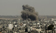 Smoke rises following what witnesses said were Israeli air strikes in Gaza August 26, 2014...