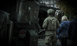 An American soldier is seen standing near armored vehicles visible for the public during N...