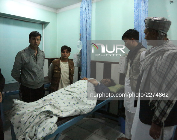 An injured man receives the medical treatment at a hospital in Kabul, capital of Afghanistan, on Oct. 20, 2017. At least 30 people were kill...