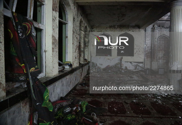 Photo taken on Oct. 20, 2017 shows the scene inside a mosque after an attack in Kabul, capital of Afghanistan. At least 30 people were kille...