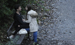 A young couple is seen on a bench near the banks of the river Brda on October 28, 2017. Me...