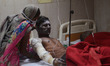 Mourn wife of a victim of NTPC boiler explode ,sit next to her son, in Civil hospital , in...