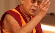 Tibetan spiritual leader Dalai Lama looks at the KIIT Deemed University as he receives KIS...