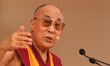 Tibetan spiritual leader Dalai Lama looks at the KIIT Deemed University as he receives KIS...