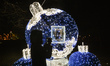 A lady take a photo of Christmas decoration near Krakow's Planty Park.On Thursday, Decemb...