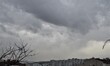Dark clouds are seen over residential buildings during a rainy day in Ankara, Turkey on De...