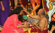 Tamil Hindu priest blesses devotees as part of the homa during the Theertham Thiruvizha Fe...