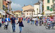 Caorle, Veneto, Italy . May 2014,  People walks and rides on bikes in the Caorle old town...
