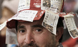 Spectators wearing fancy dress attend the draw of Spain's Christmas lottery named 'El Gord...