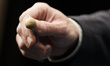 An official of the Spanish national lottery shows 'El Gordo' (the fat one) winning ball of...