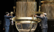  An official fills a drum with ball bearings of the lottery prizes during the draw of Spai...