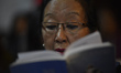 A Christian woman singing Carol Holy Mass of worshipers on Christmas Eve at Catholic Assum...