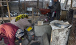 A Kashmiri man grinds water chestnuts to obtain flour at a mill on January 05, 2018 in Kol...