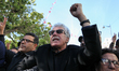 Hamma Hammami (C), leader of the Popular Front, gestures and chant slogans, as he attends...