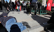 A man sleeps on the street while Tunisians celebrate the 7th anniversary of Tunisian revol...
