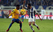 Estorils Brazilian midfielder Wesley Dias (L) vies with Porto's Mexican defender Miguel La...