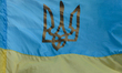 A view of an Ukrainian flag with a coat of arms, seen in Lviv's city center. On Monday, J...