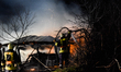 Firefighters extinguish the burning building.Farmer building has been destroyed by a fire...