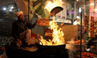 A shopkeeper fries chicken pieces at Old Delhi, India, on 3 February 2018 