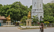 Policeman rides a bicycle past the clock tower in downtown Jaffna, Sri Lanka. 