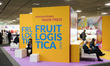 People read international trade press at the Fruit Logistica 2018 international vegetables...