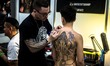 A man gets tattooed during the 23th Milano Tattoo Convention held Milan, Italy on February...