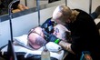 A man gets tattooed during the 23th Milano Tattoo Convention held Milan, Italy on February...
