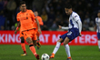 Porto's Mexican defender Diego Reyes (R) in action with Roberto Firmino forward of Liverpo...