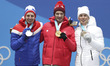 Champion Dario Cologna (C) of Switzerland, second-placed Simen Hegstad Krueger (L) of Norw...
