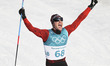 Dario Cologna of Switzerland celebrates after finishing men's 15km free event of cross cou...