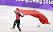 Li Jinyu of China celebrates after finishing ladies' 1500m final of short track speed skat...