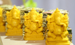 Sindoor (kumkum) boxes adorned with Lord Ganesh displayed during a South Indian and Tamil...