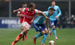 Braga's Portuguese midfielder Andre Horta ( L ) vies for the ball with Marseille's Argenti...