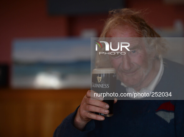 A local man enjoys his pint of Guinness in Cleggan's Pub. Connemara, County Galway, Ireland. Photo: Artur Widak /NurPhoto 