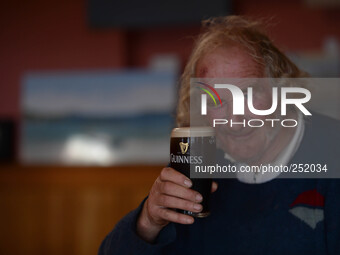 A local man enjoys his pint of Guinness in Cleggan's Pub. Connemara, County Galway, Ireland. Photo: Artur Widak /NurPhoto (