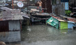 A resident stays on a rooftop to escape rising floodwaters in Quezon city, suburban Manila...