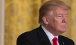 U.S. President Donald Trump winks at an attendee, as Prime Minister Stefan Löfven of Swede...