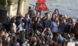Paris' mayor Anne Hidalgo (C) takes part in a demonstration on March 10, 2018 on the Seine...